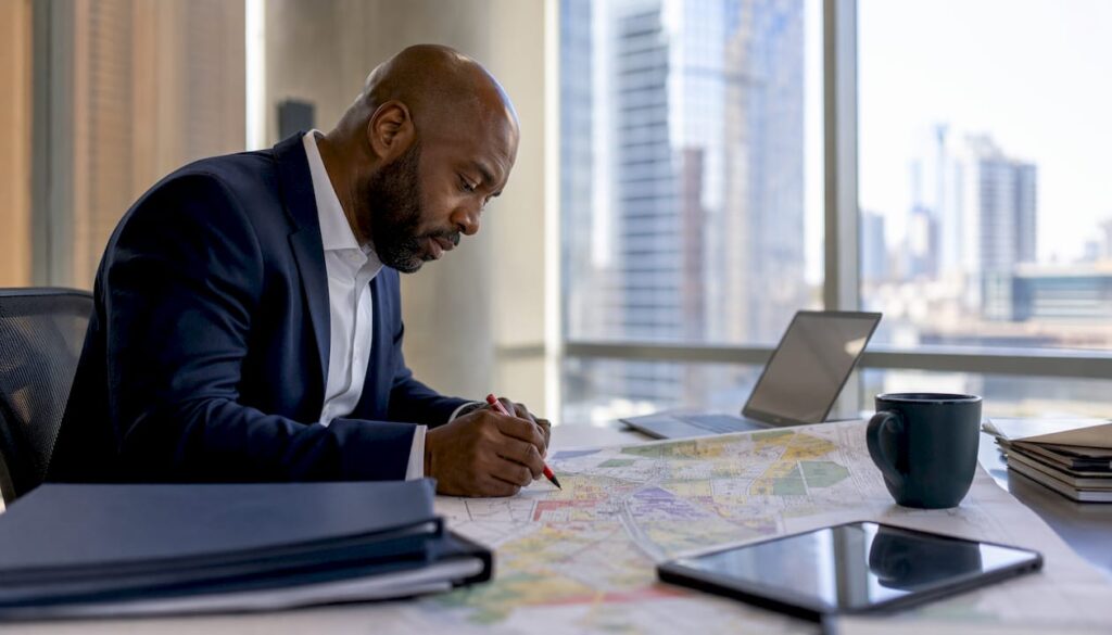 Urban planner reviewing Charlotte zoning maps