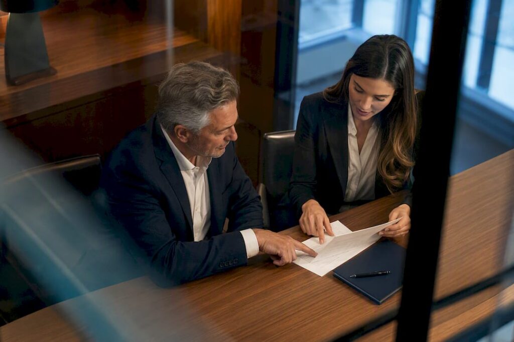 Owner and advisor reviewing agency agreement