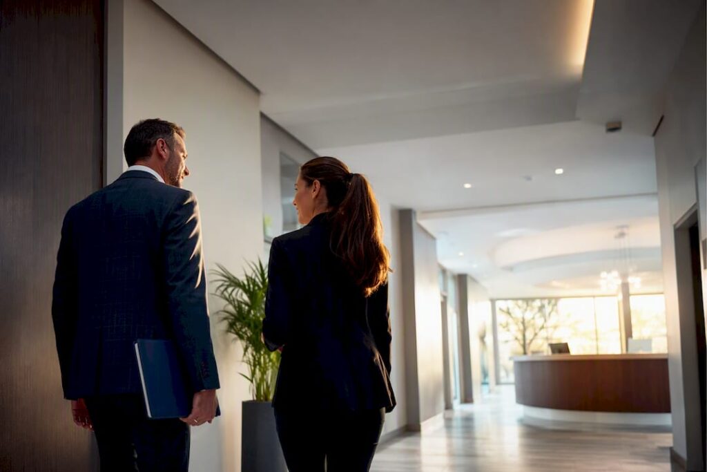 Owner and practitioner inspecting medical office suite