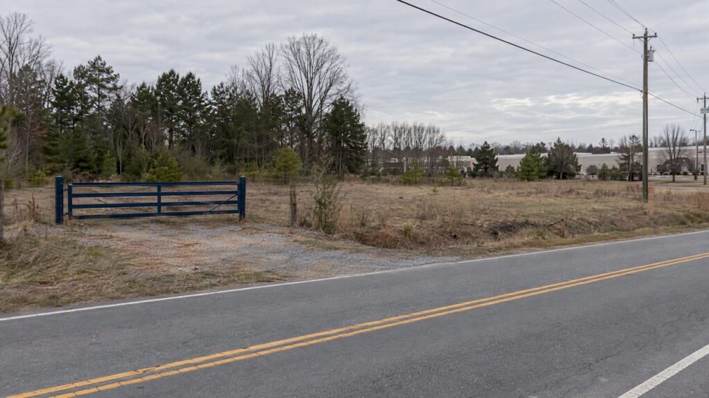 Undeveloped commercial parcel beside a road